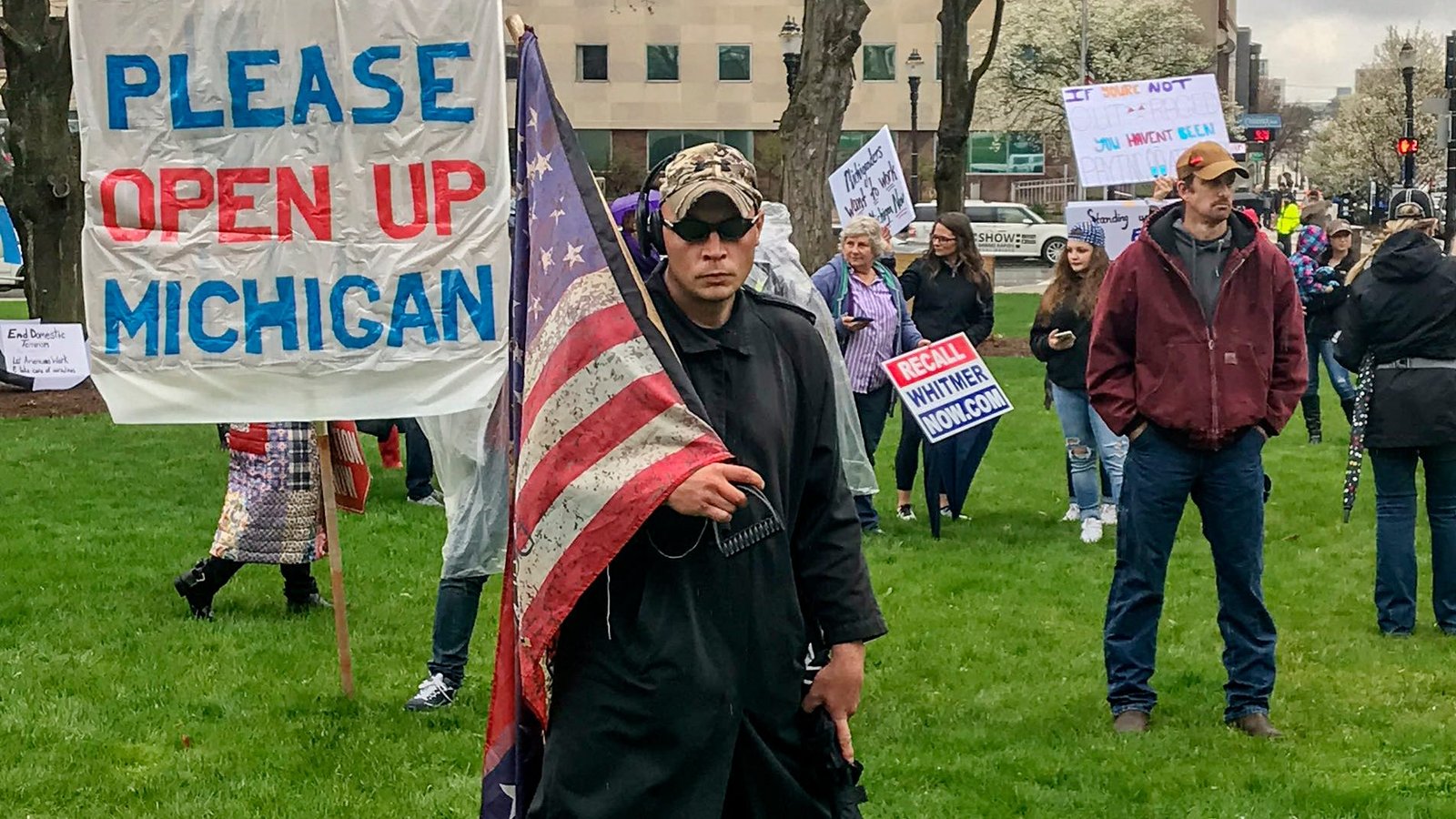 Protesters, some carrying rifles, crowd into Michigan Capitol to urge an end to state of emergency
