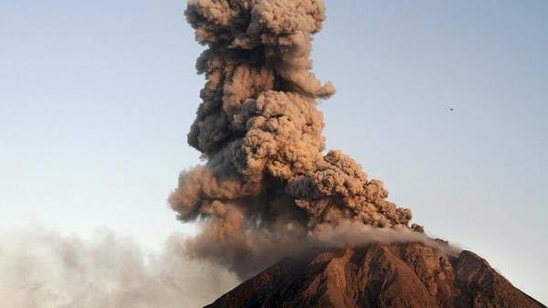 indonesian volcano belches huge tower of smoke and ash