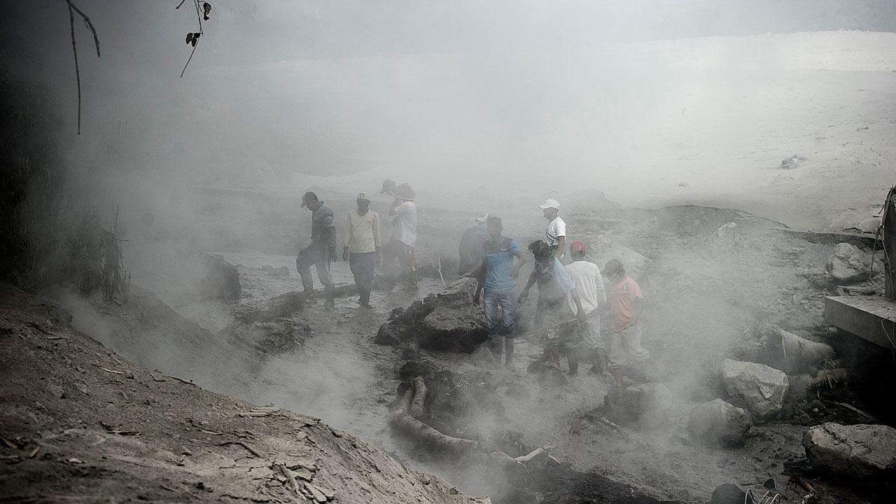 hundreds flee as indonesian volcano spews lava and ash