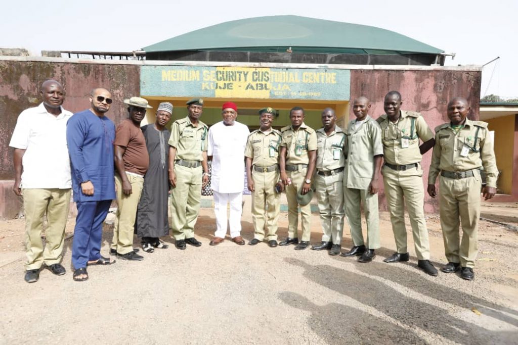 Sen. Orji Uzor Kalu (M) flanked by Prisons officers at Nigerian Correctional Centre Kuje, FCT, Abuja