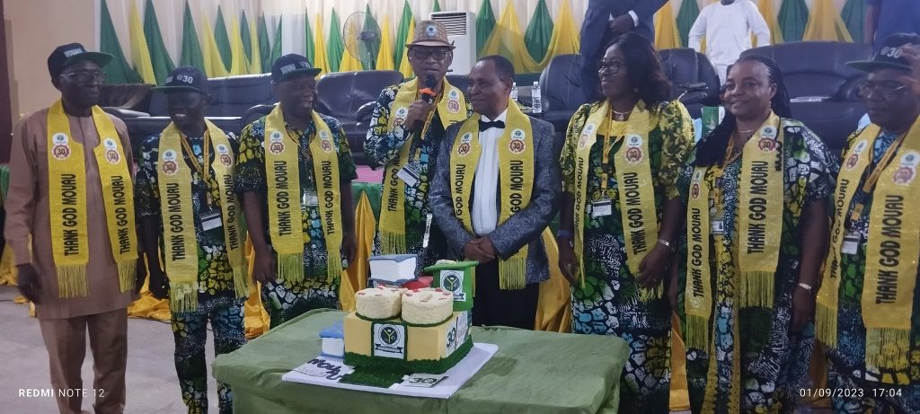 Prof. Maduebibisi Ofo Iwe, the Vice Chancellor of Michael Okpara University of Agriculture, Umudike, (MOUAU),  (4L) and Prof. Ogbonna Onwudike, the second VC, Michael Okpara University of Agriculture (5L) flanked by other awardees during the cutting of the school's 30th Anniversary cake.
