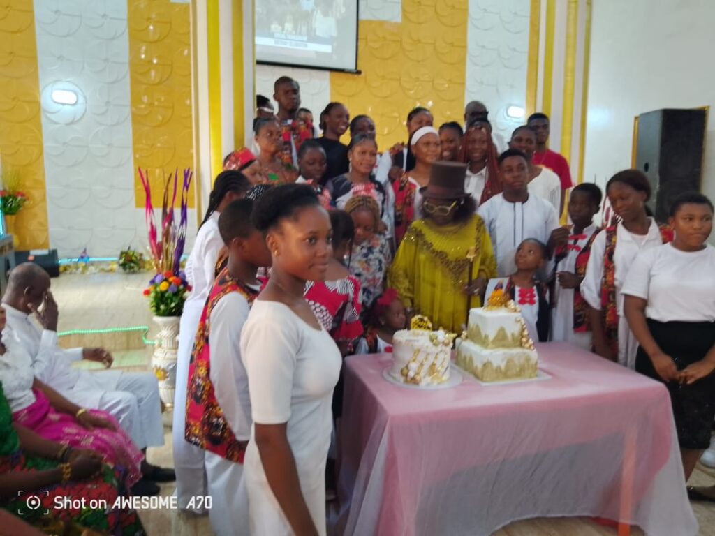 Hon. Patricia Ajudua, cutting her 62nd birthday cake with members of Christ Restoration Praise and Worship   Chapel, Ibusa, Delta state.