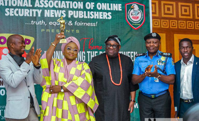 The Honourable Minister of State for Police Affairs, Hajia Imaan Sulaiman-Ibrahim, flanked by secure stakeholders at 2024 NAOSN award.