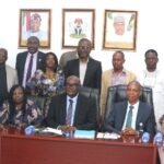 L-R: Permanent Secretary, Ministry of Police Affairs, Dr. Anuma Ogbonnaya Nila receiving hand over note from the Director overseeing the office of the Permanent Secretary, Mr. Okehie Isaac Tochukwu during a meeting with the Management and staff of the Ministry on his assumption of duty at the Ministry of Police Affairs Headquarters in Abuja