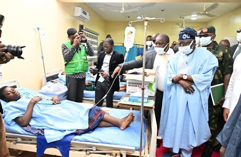 President Bola Ahmed Tinubu sympathising with one of the victims of Benue massacre.