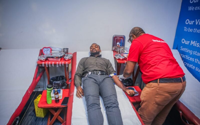 Access Bank staff donating free blood in commemoration of World Blood Donor Day and World Sickle Cell Day 2025.