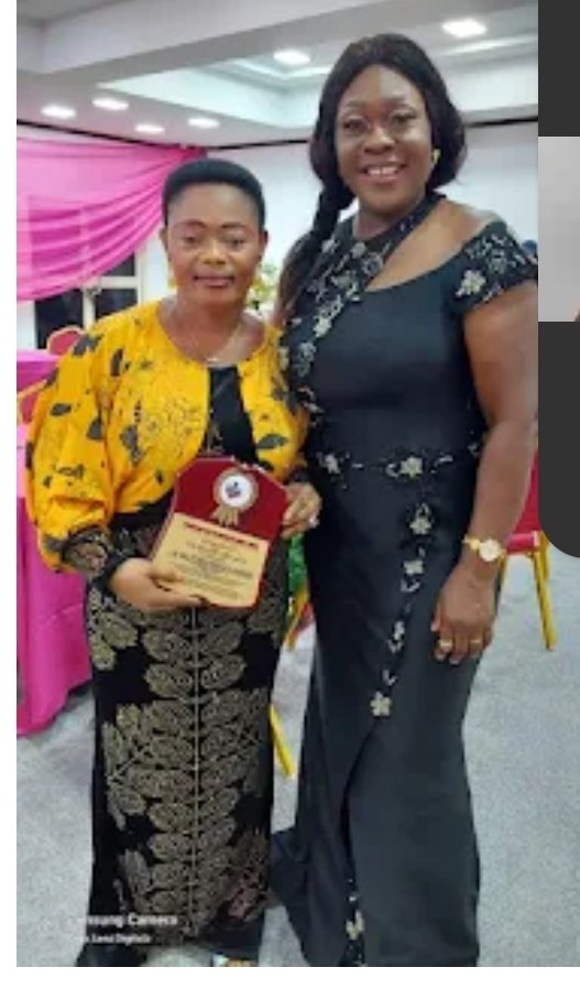 Late Comrd. Nma Ozioma Onwuka-Okereke (L), displaying her award presented to her by StandUp For Women Society (SWS).