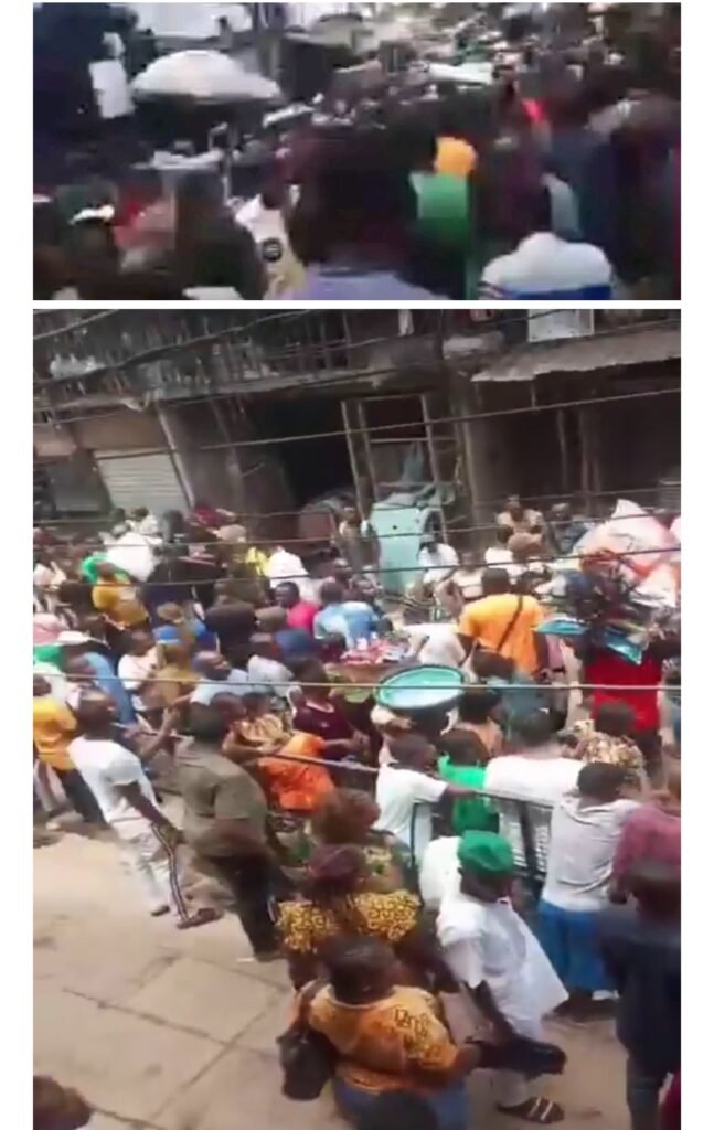 A group of Anambra youths fleeing from the terror of a team of Operation Keep Onitsha Healthy and Clean at Onitsha Main Market.