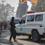 An ambulance heads toward a stadium to collect the body after a public execution carried out by Taliban authorities of a man sentenced by the Supreme Court for killing 13 members of a family, including children, earlier this year, in the eastern city of Khost,(AP).