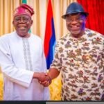 President Bola Ahmed Tinubu in a hand shake with Dr. Okezie Victor. Ikpeazu