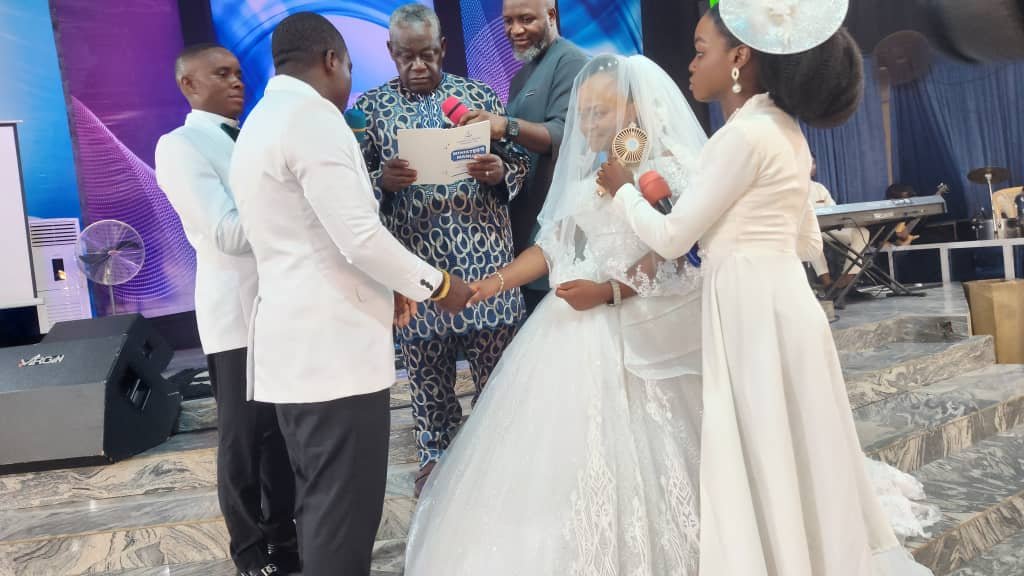 Mr. Emmanuel Onyemaechi and Miss Chiamaka Ettu exchanging rings and vows in a holy matrimony at Christian Renewal Ministries (CRM).
