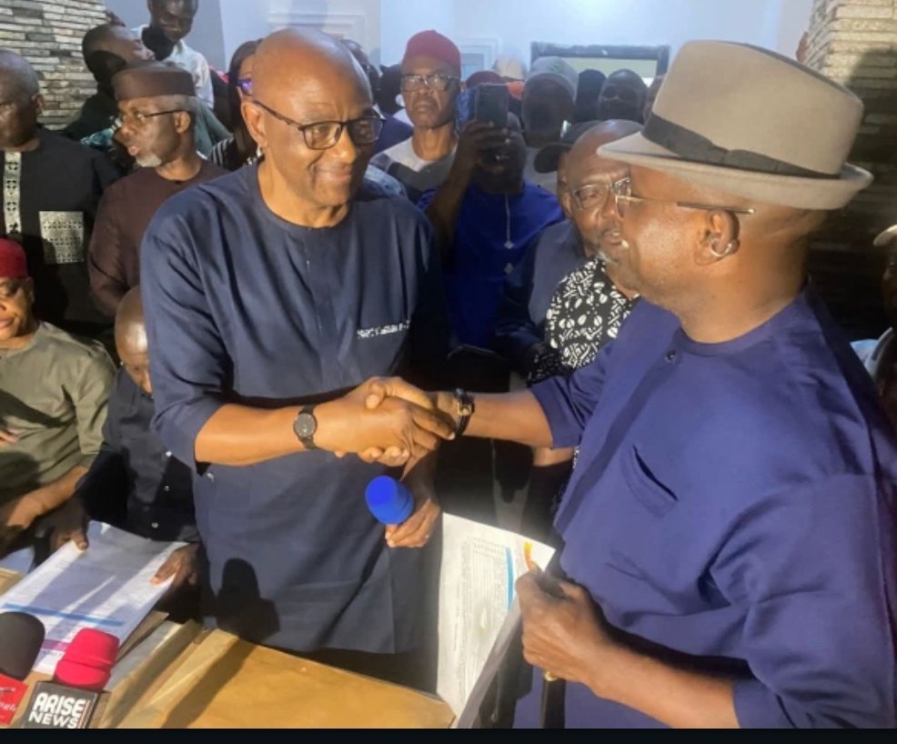 Hon. Erondu Erondu, in a handshake with the returning officer of the 2026 APC Primaries election in Abia State.