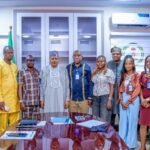 Hon. Minister of Information and National Orientation, His Excellency Idris Mohammed ((6L); Comrd. Akpovoke Otiti (5L), flanked by other members of Online Media Editors and Publishers GOMEP-NG and staff of the ministry.