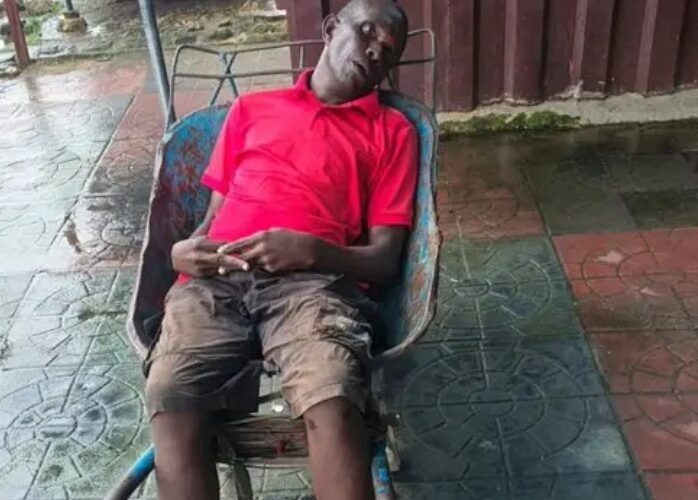 An unidentified wheelbarrow pusher who died while resting in Aba-Owerri road, Abia State